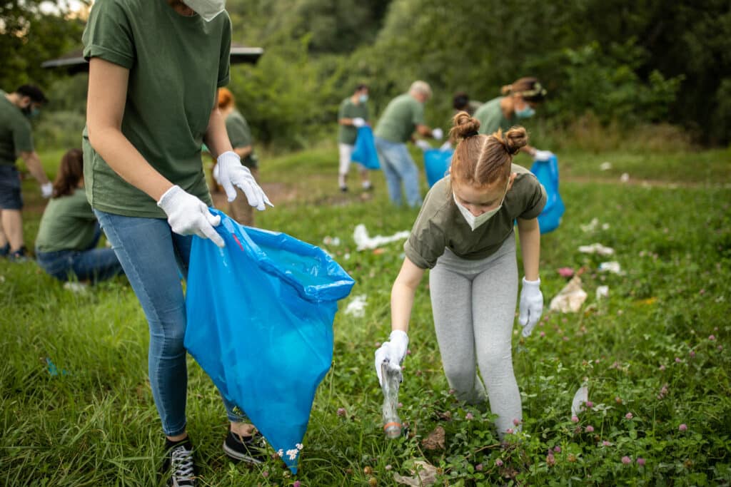 Littler Girl Picking up Litter