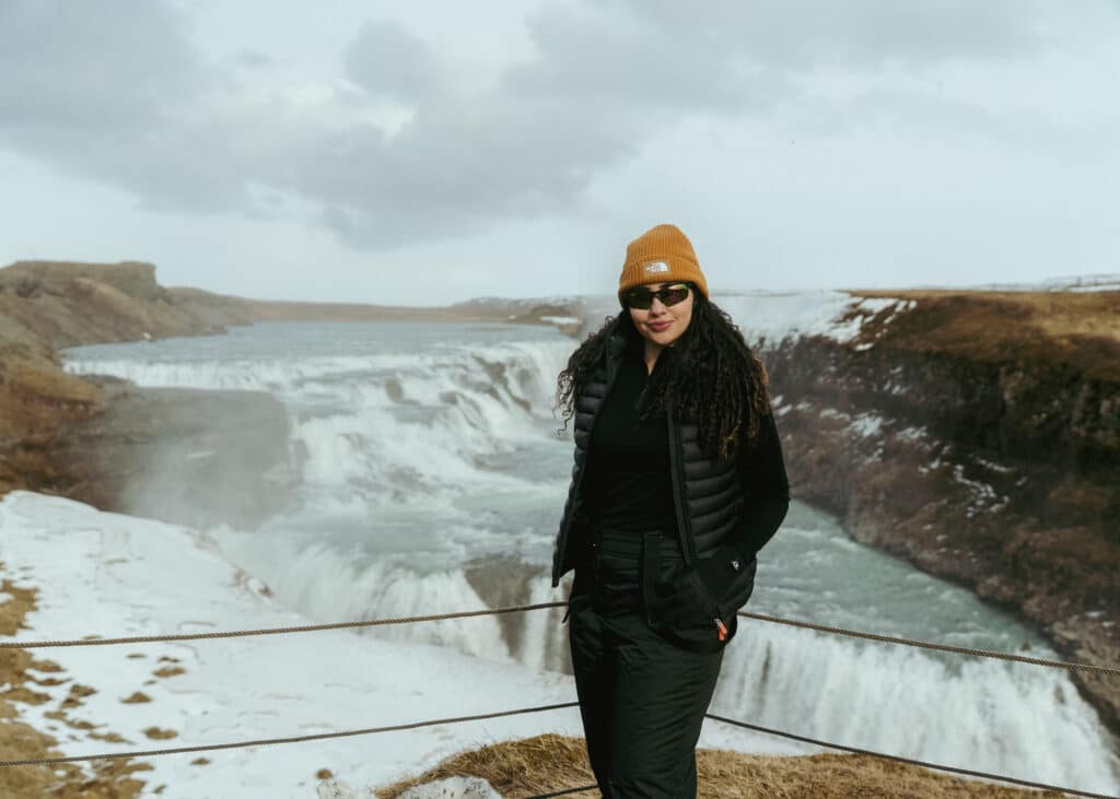 From Iceland to Impact: Chelsea's Inspiring Sustainability Journey at Citi for Accessible Housing & Economic Progress 1 Chelsea Cruz standing in front of Gullfoss Waterfall in Iceland