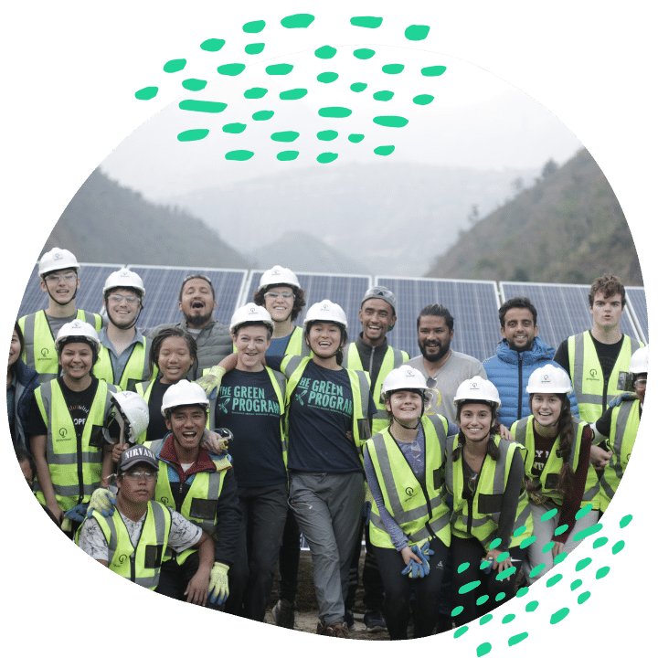 sustainability team in front of solar panels